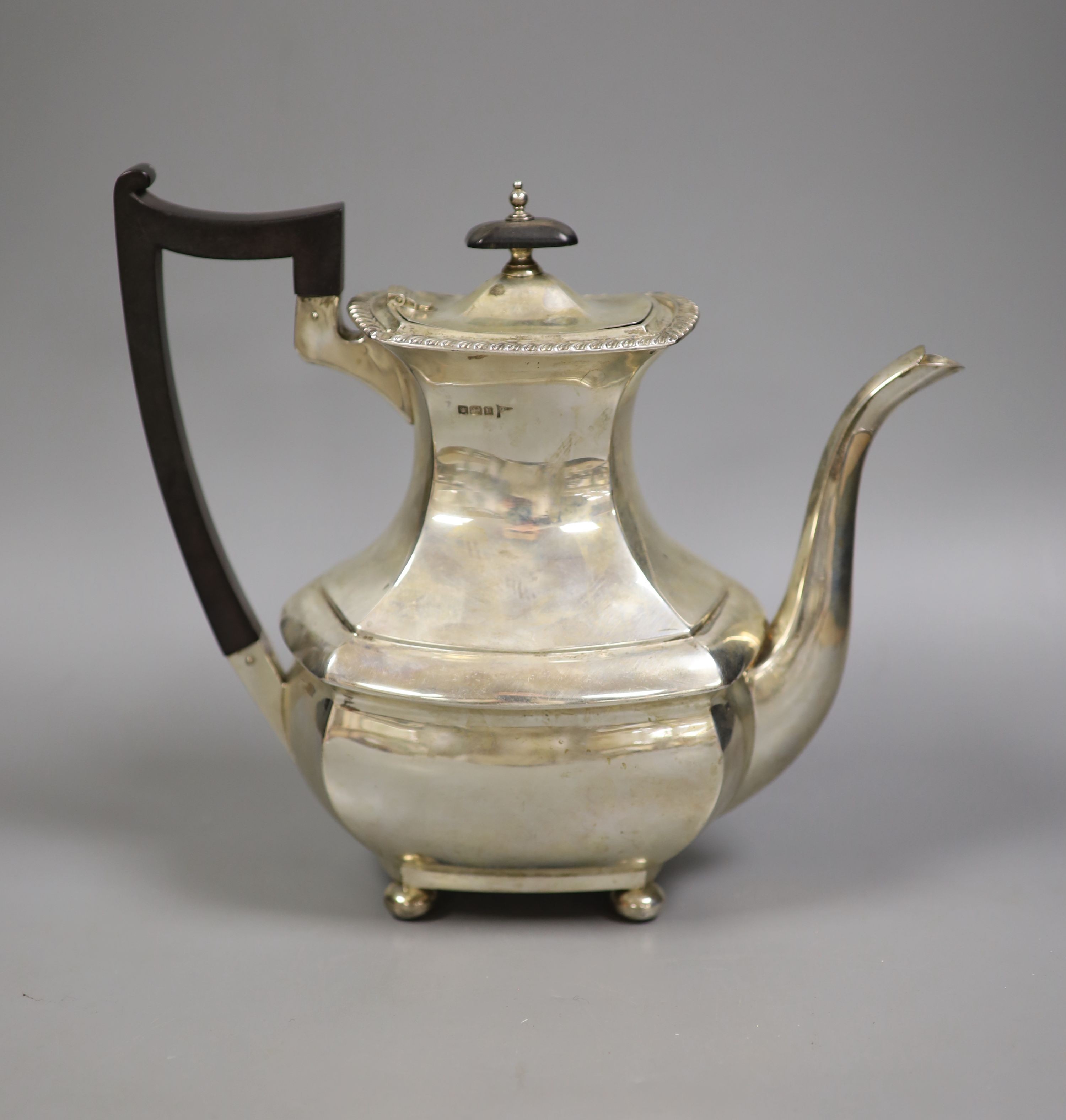 A George V silver coffee pot, by Walker & Hall, Sheffield, 1913, gross 27oz.